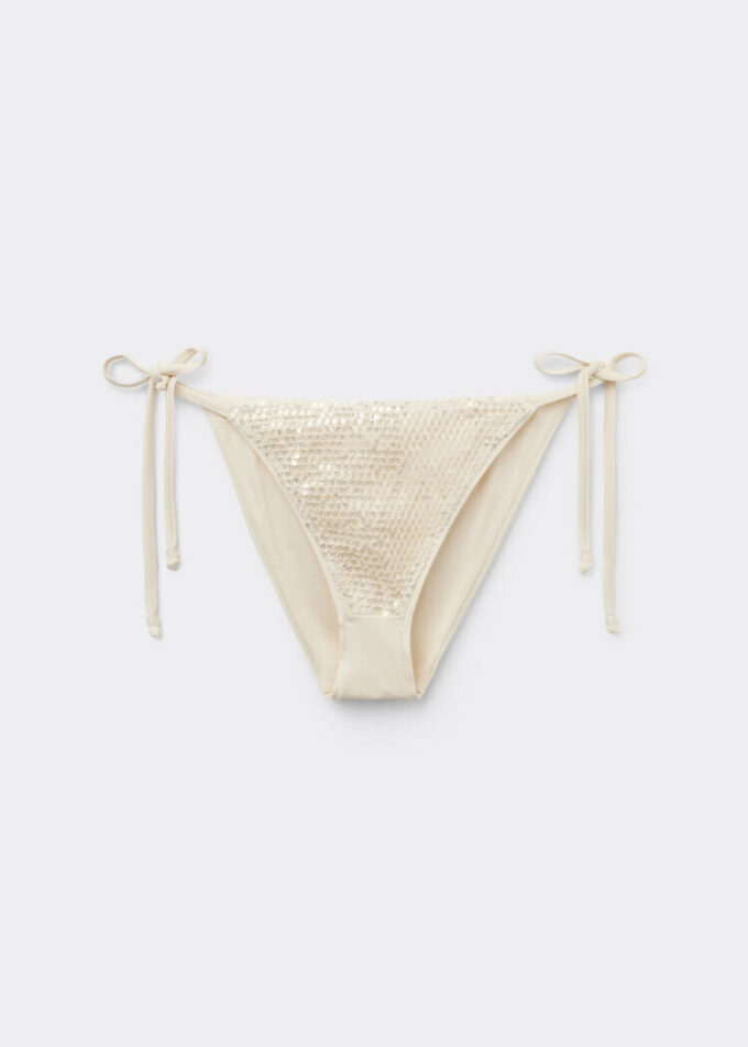 Stringbikinibotten i nät med paljetter Stringbikinibotten i nät med paljetter